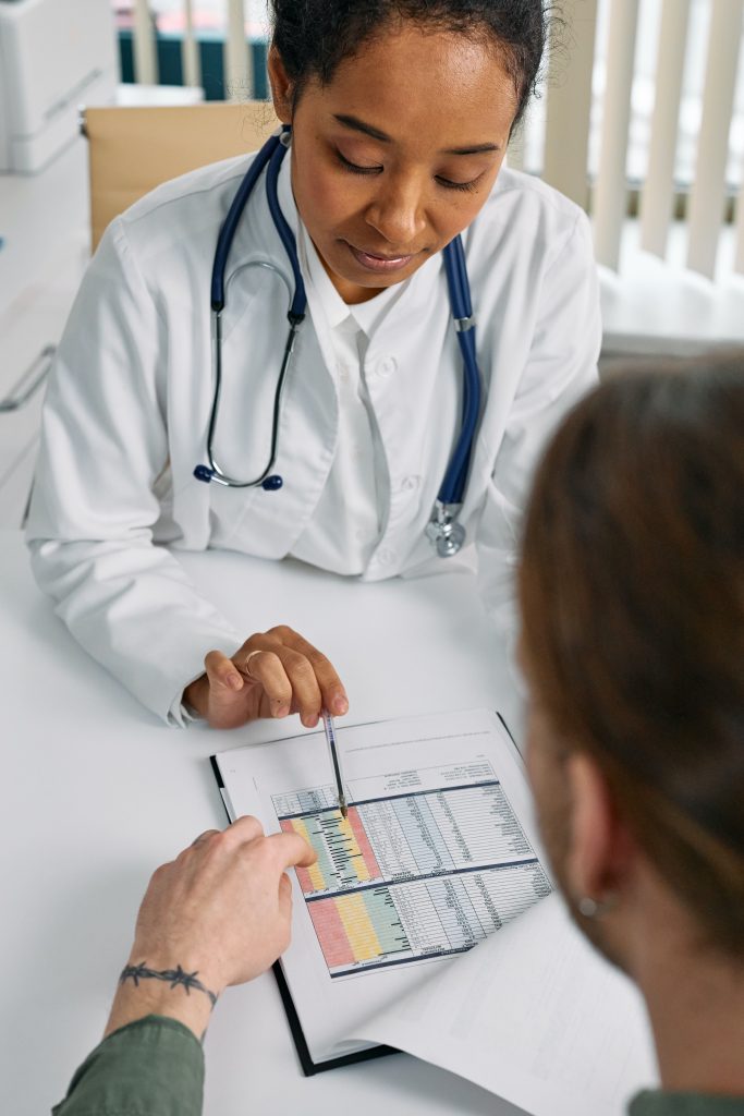 A photograph of a clinician booking an appointment